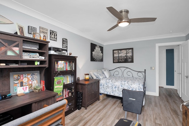 bedroom featuring ornamental molding, ceiling fan, and light hardwood / wood-style flooring