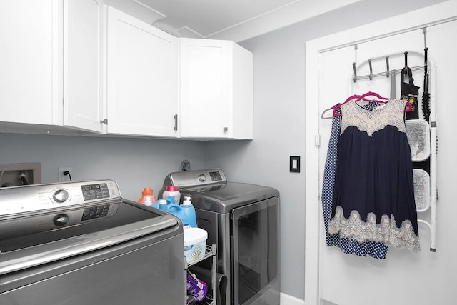 laundry room featuring cabinets and independent washer and dryer