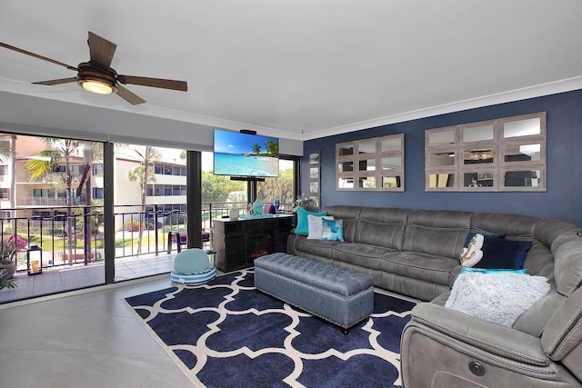 living room featuring tile patterned flooring, crown molding, and ceiling fan