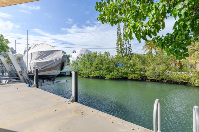 dock area featuring a water view and boat lift