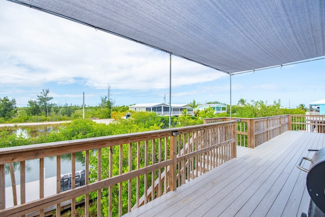 wooden terrace with a water view