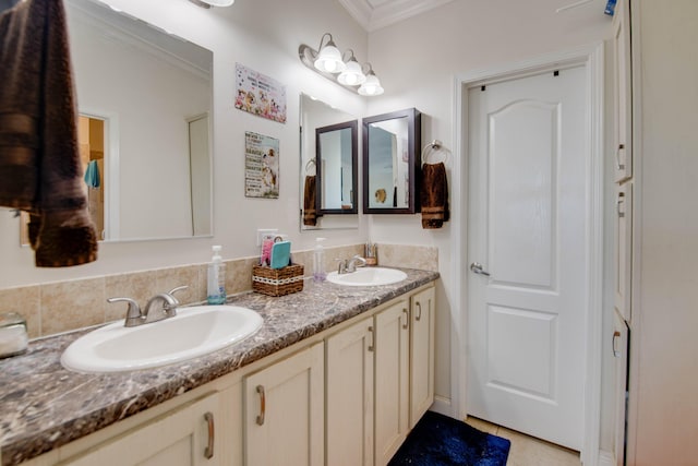 bathroom featuring ornamental molding and vanity