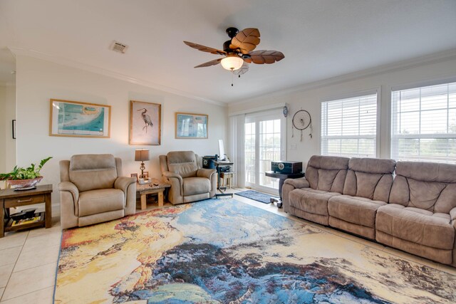 tiled living room with ornamental molding and ceiling fan