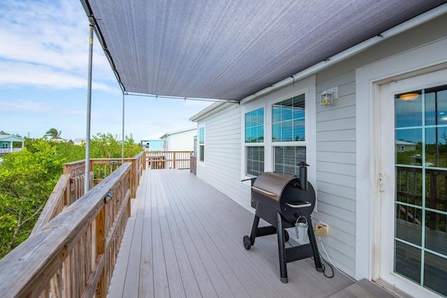 wooden deck with area for grilling