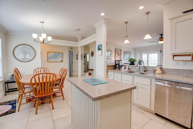 kitchen with sink, crown molding, dishwasher, a kitchen island, and decorative light fixtures