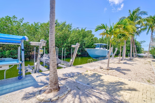 29012 Bigonia Dr, Big Pine, FL 33043 - view of yard featuring boat lift, a dock, and a water view