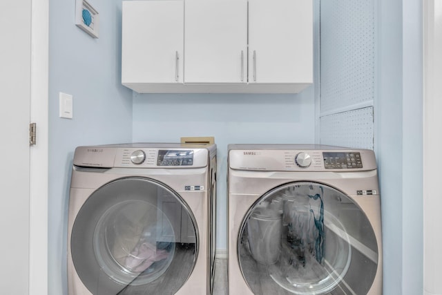 29012 Bigonia Dr, Big Pine, FL 33043 - laundry area featuring washer and clothes dryer and cabinet space