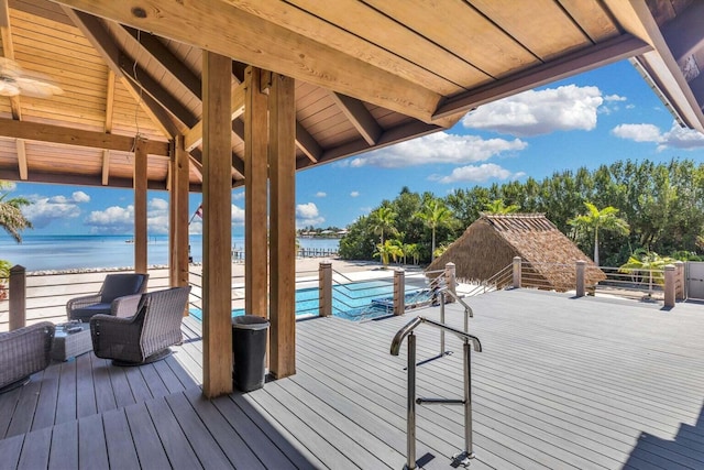 wooden terrace with a water view