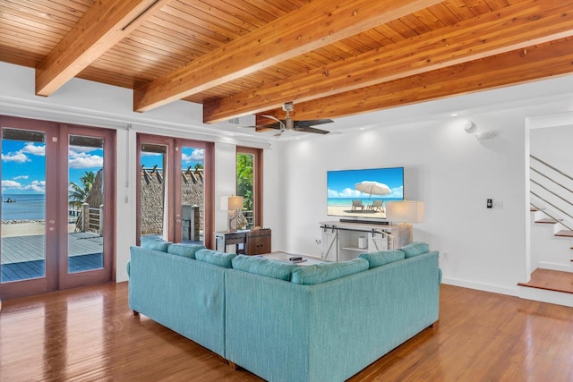 living room with beamed ceiling, ceiling fan, hardwood / wood-style floors, and wooden ceiling