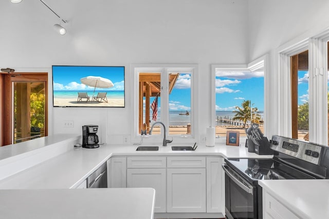 kitchen featuring white cabinetry, appliances with stainless steel finishes, and sink