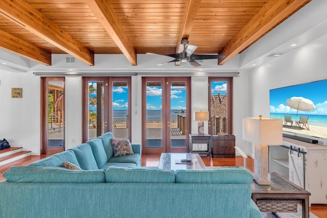 living room with beam ceiling, wood ceiling, ceiling fan, and hardwood / wood-style flooring