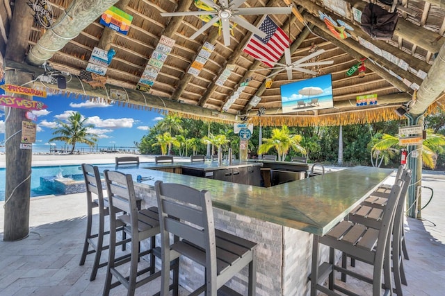 view of patio / terrace with a gazebo, an outdoor bar, and ceiling fan