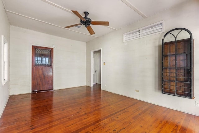 spare room featuring dark hardwood / wood-style flooring and ceiling fan