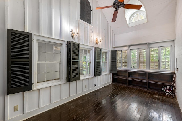 unfurnished sunroom with vaulted ceiling and ceiling fan