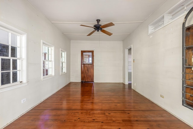 spare room featuring dark hardwood / wood-style floors and ceiling fan