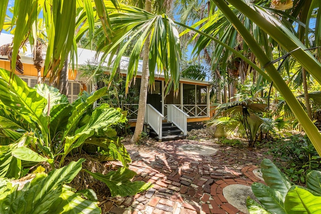 view of patio / terrace with a sunroom