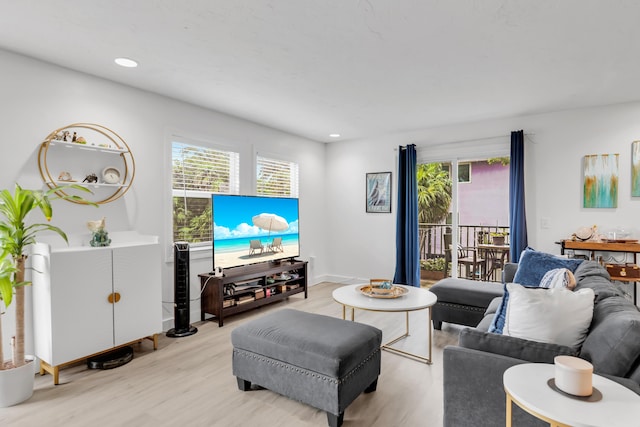 living room with light hardwood / wood-style flooring