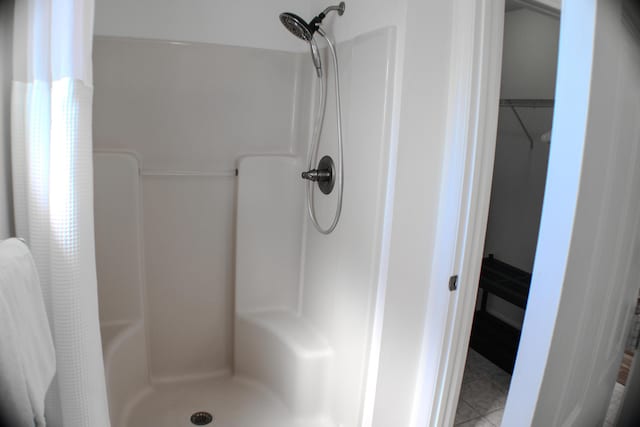 bathroom with a shower with shower curtain