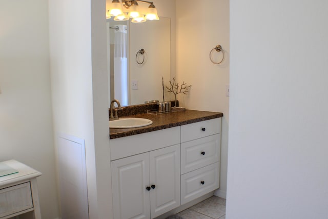 bathroom with vanity and tile patterned flooring