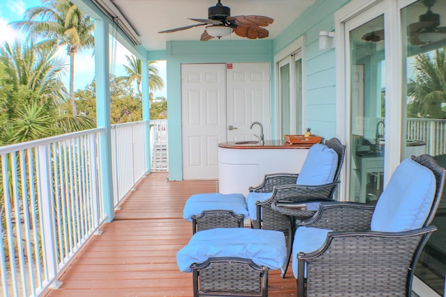 sunroom / solarium with ceiling fan