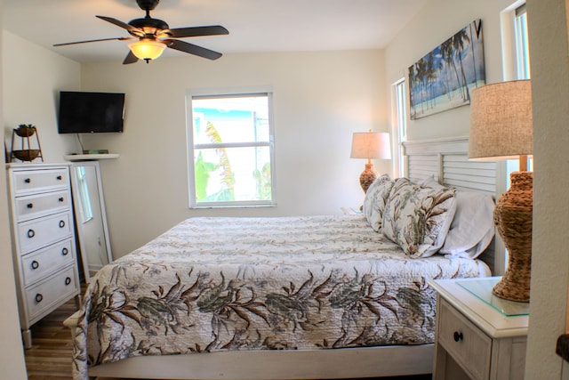 bedroom with ceiling fan and wood-type flooring