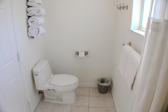 bathroom featuring tile patterned floors and toilet