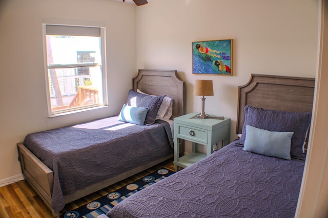 bedroom with hardwood / wood-style floors