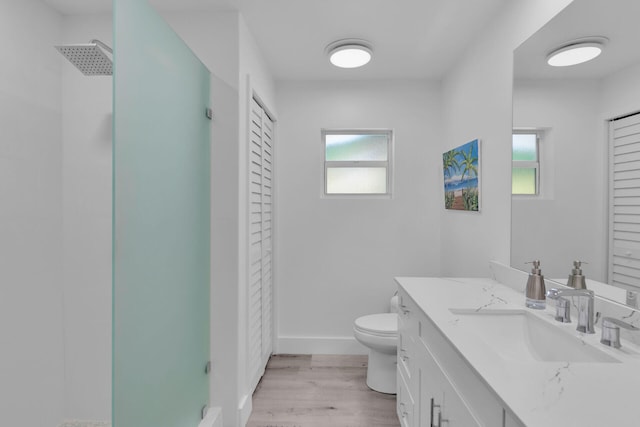 1412 Johnson St, Key West, FL 33040 - bathroom with a closet, a walk in shower, vanity, and wood finished floors