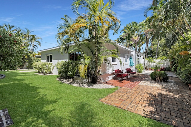 1412 Johnson St, Key West, FL 33040 - view of green lawn featuring a patio area