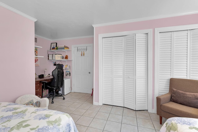 1412 Johnson St, Key West, FL 33040 - bedroom with light tile patterned floors, ornamental molding, an office area, and multiple closets