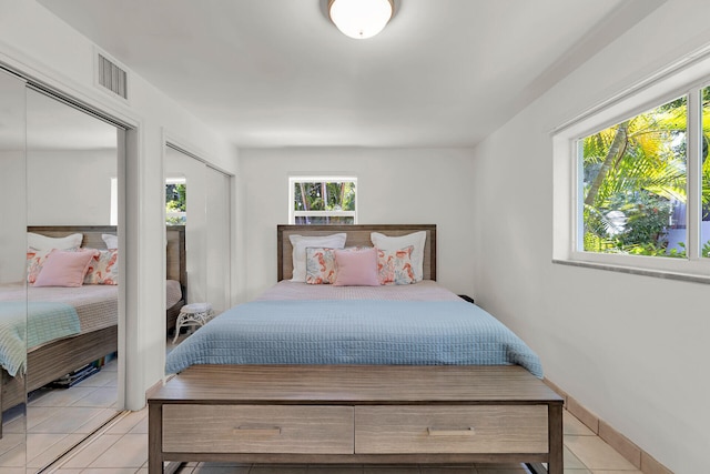 1412 Johnson St, Key West, FL 33040 - bedroom with light tile patterned floors and two closets