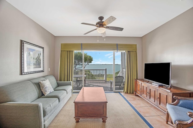 tiled living room featuring ceiling fan