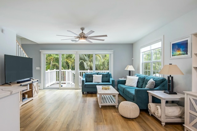 living area featuring ceiling fan and light wood-style flooring