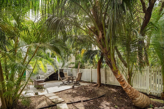 exterior space with fence private yard and stairs