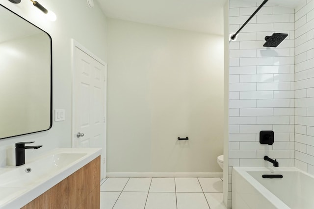 full bathroom with tile patterned flooring, vanity, tiled shower / bath, and toilet