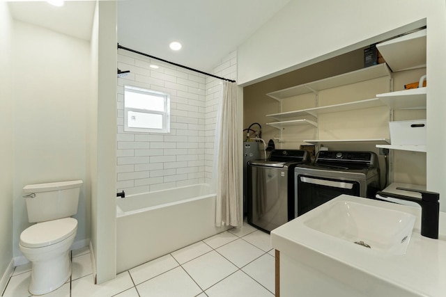 full bathroom with washer and dryer, sink, shower / tub combo, toilet, and tile patterned floors