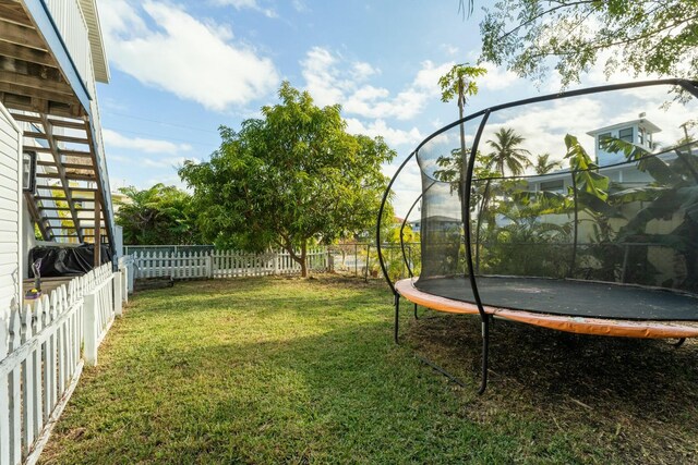 view of yard with a trampoline