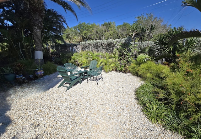 view of yard with fence and a patio