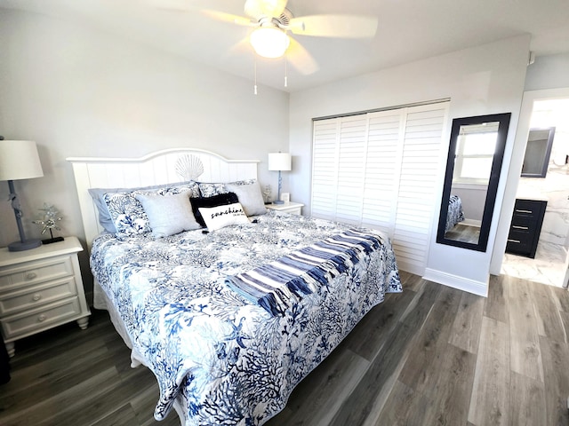 bedroom featuring a ceiling fan, dark wood-style flooring, and baseboards