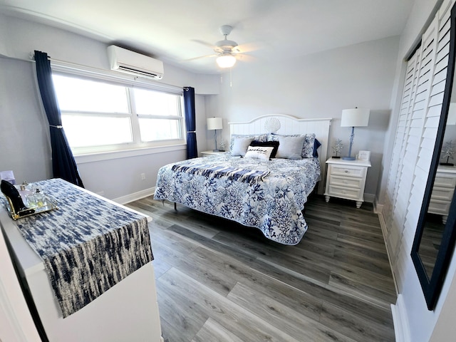 bedroom with dark wood-type flooring, ceiling fan, baseboards, and a wall mounted AC