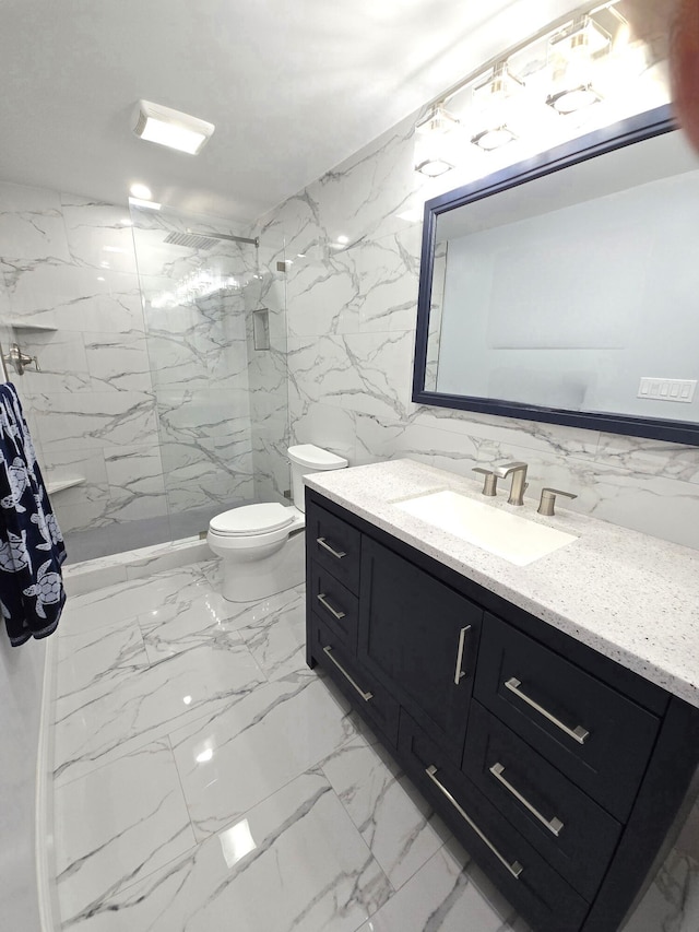 bathroom with a marble finish shower, toilet, marble finish floor, vanity, and stone wall