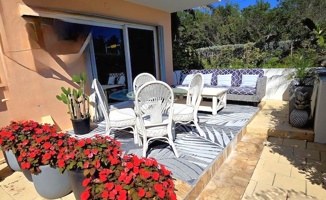 exterior space featuring an outdoor hangout area, outdoor dining area, and a patio