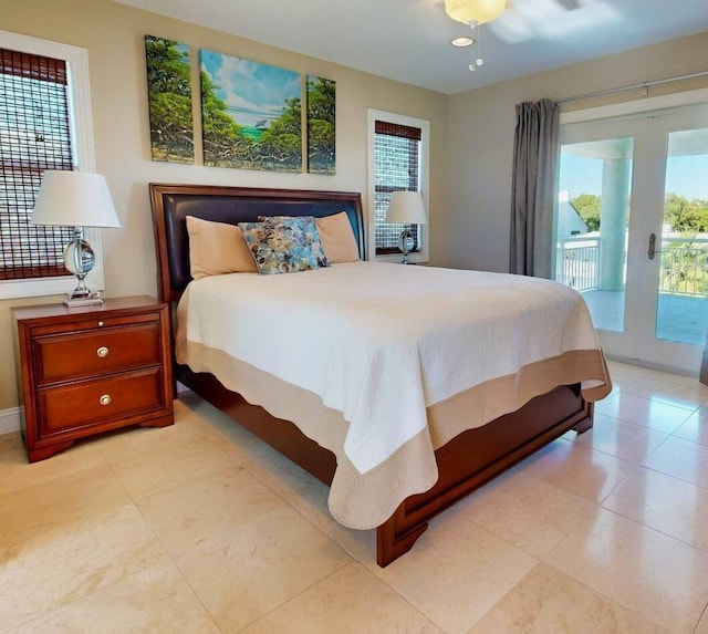 bedroom with multiple windows, access to exterior, and french doors