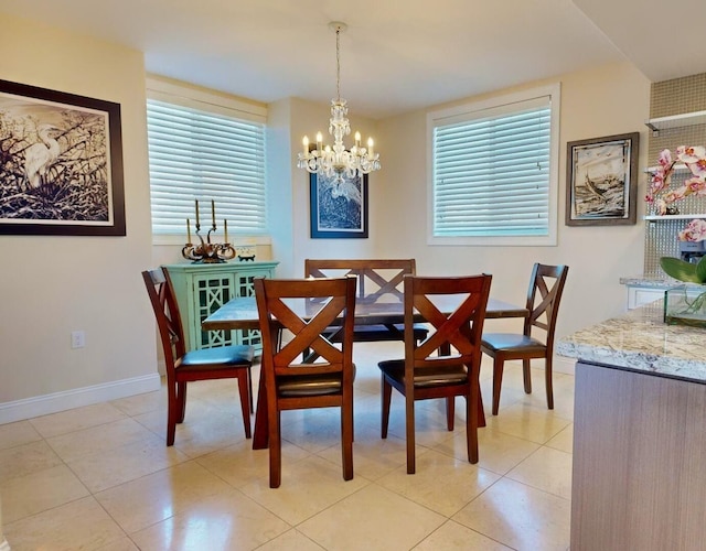 tiled dining area with a notable chandelier