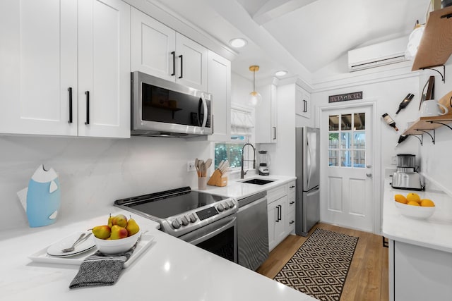 321 Julia St, Key West, FL 33040 - kitchen with stainless steel appliances, open shelves, light countertops, white cabinetry, and lofted ceiling