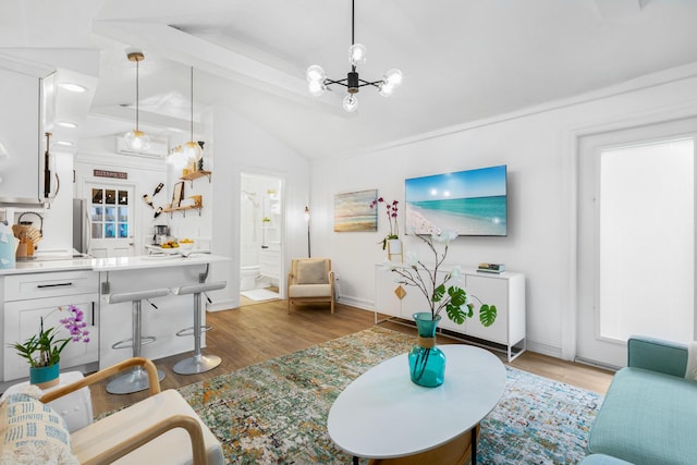 321 Julia St, Key West, FL 33040 - living area with lofted ceiling, light wood-style flooring, and a chandelier