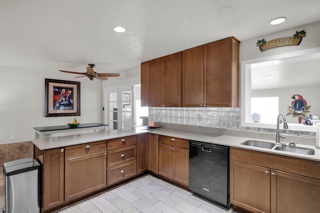 kitchen with sink, dishwasher, ceiling fan, decorative backsplash, and kitchen peninsula