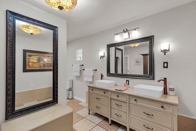 bathroom featuring vanity and tile patterned flooring