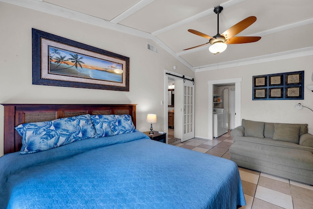 bedroom featuring light tile patterned floors, ceiling fan, lofted ceiling with beams, washer / clothes dryer, and a barn door