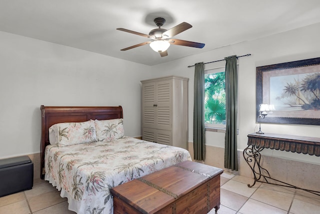 tiled bedroom featuring ceiling fan